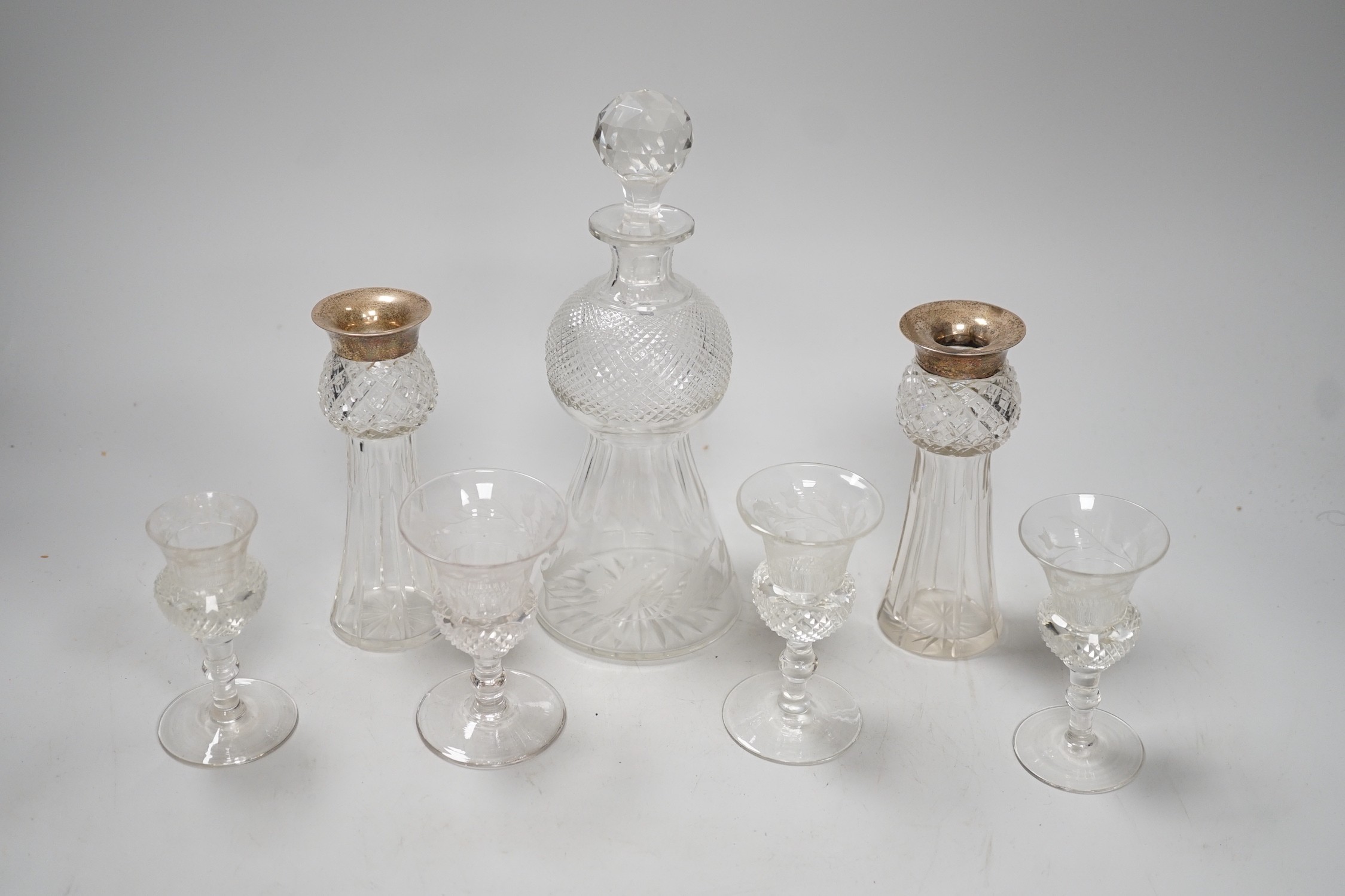 A late Victorian engraved thistle shaped liqueur decanter, 4 glasses and a pair of silver mounted jars